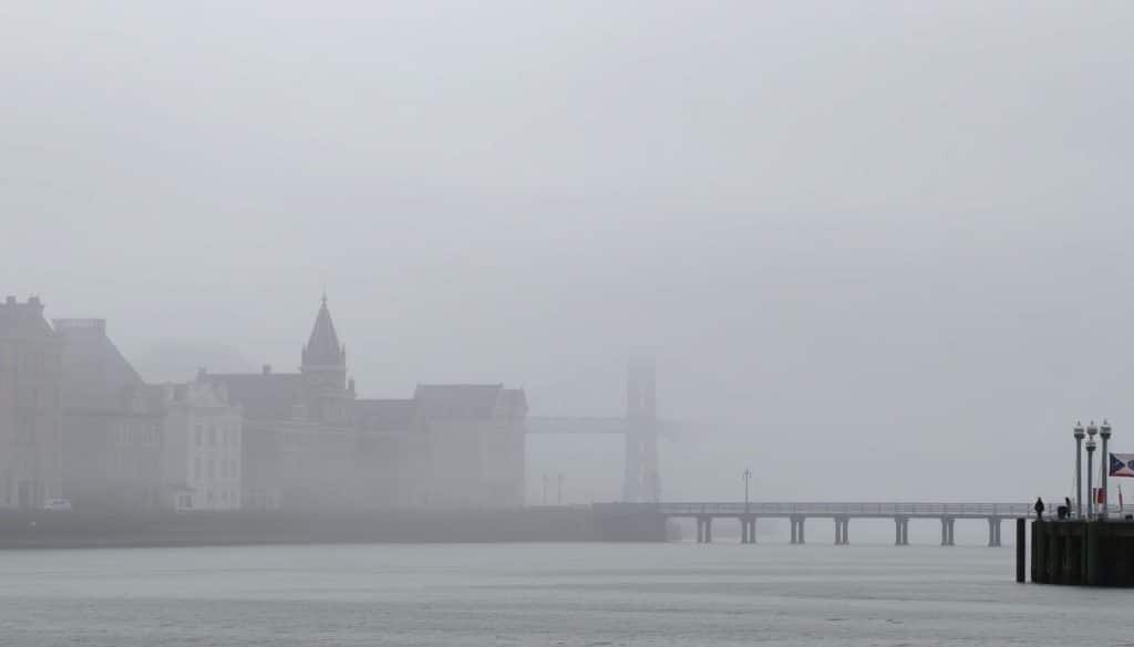 Astoria Oregon waterfront on a misty morning showing seasonal atmosphere