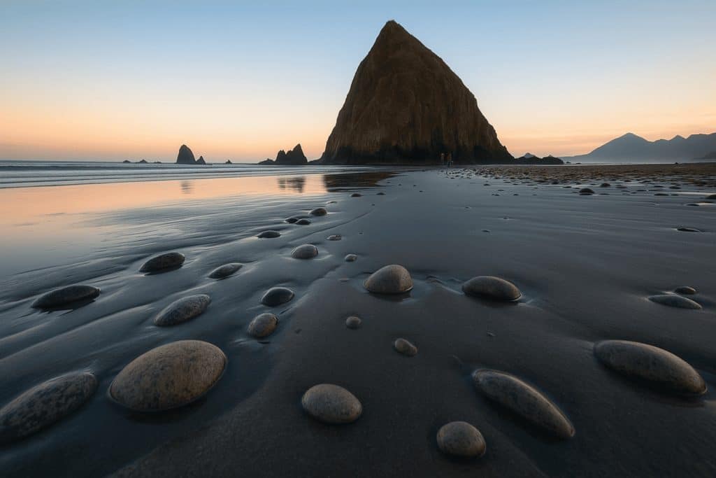 Haystack Rock at Cannon Beach with exposed tide pools during Oregon tide pool exploration
