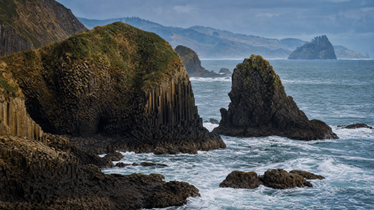 Dramatic basalt rock formations and sea stacks on the Oregon Coast