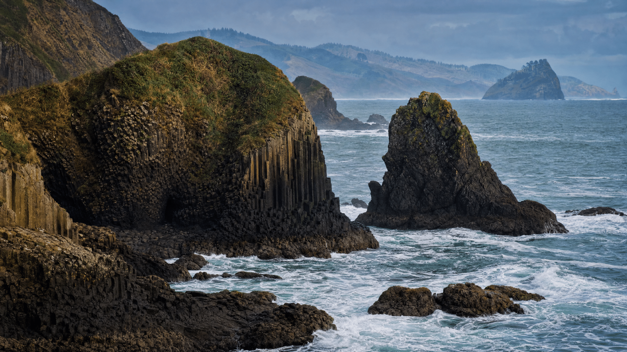 Dramatic basalt rock formations and sea stacks on the Oregon Coast