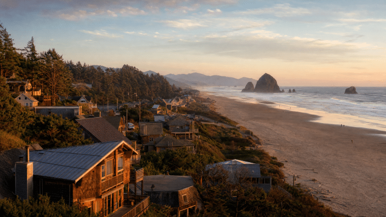 Scenic coastal town view with sandy beach and sea stacks at Rockaway Beach area