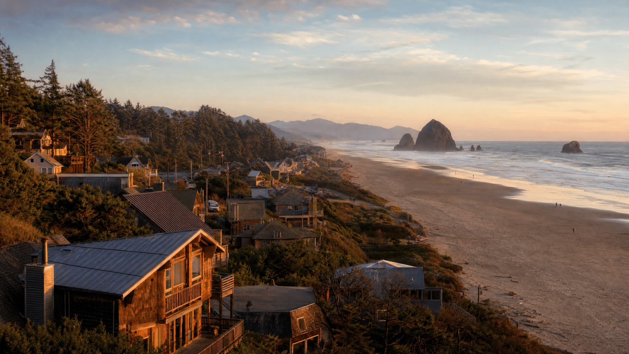 Scenic coastal town view with sandy beach and sea stacks at Rockaway Beach area
