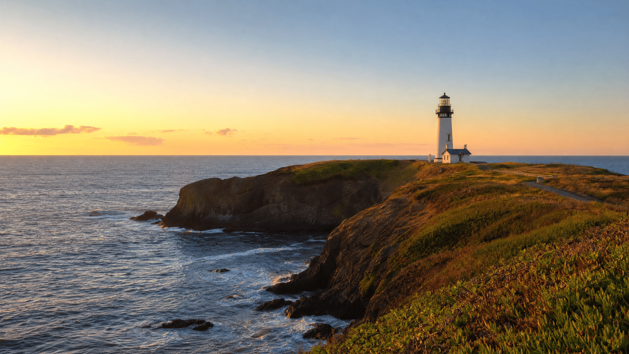 Yaquina Head lighthouse and dramatic rocky headland on the Oregon Coast
