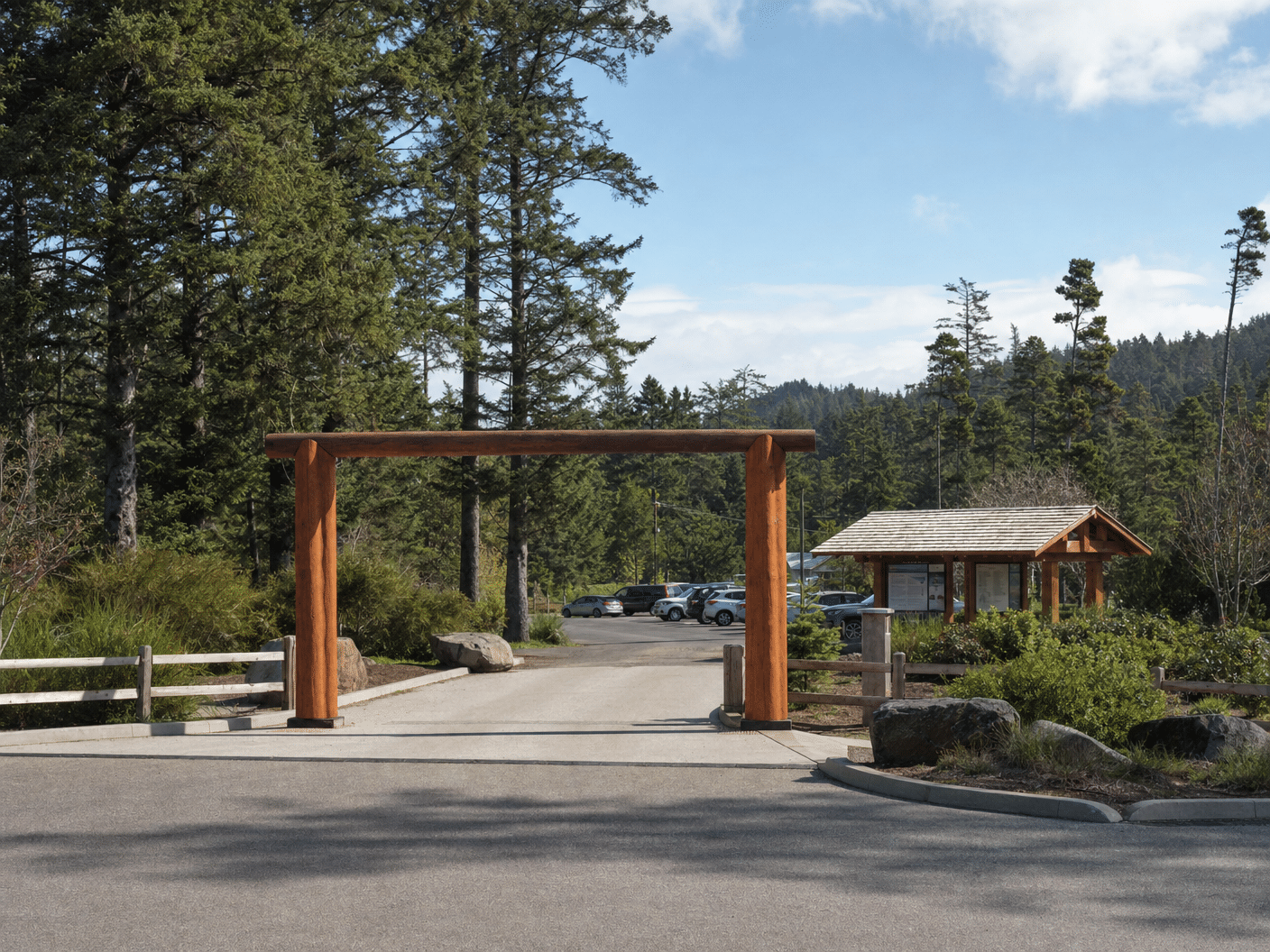 State park entrance gate and parking area with natural landscape