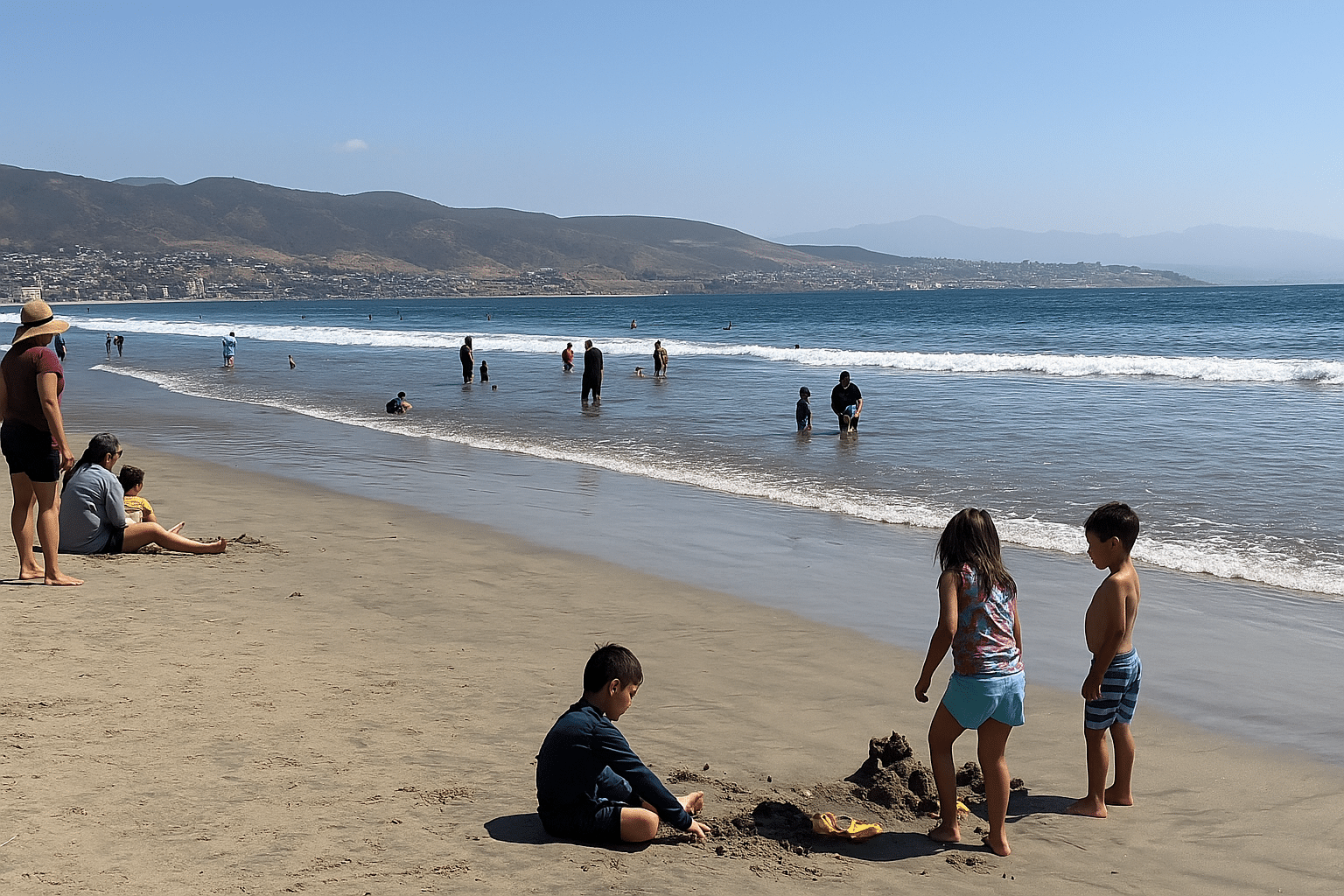 Families enjoying the beach in Ensenada.