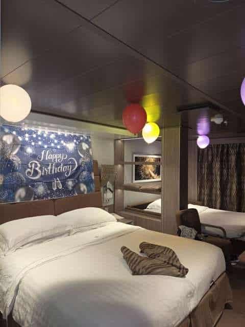 Cruise cabin decorated with balloons for a birthday