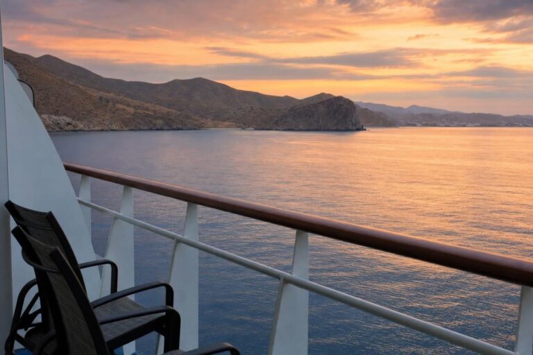 Sunset view of the Pacific and desert coastline from a cruise ship balcony on a Mexican Riviera sailing