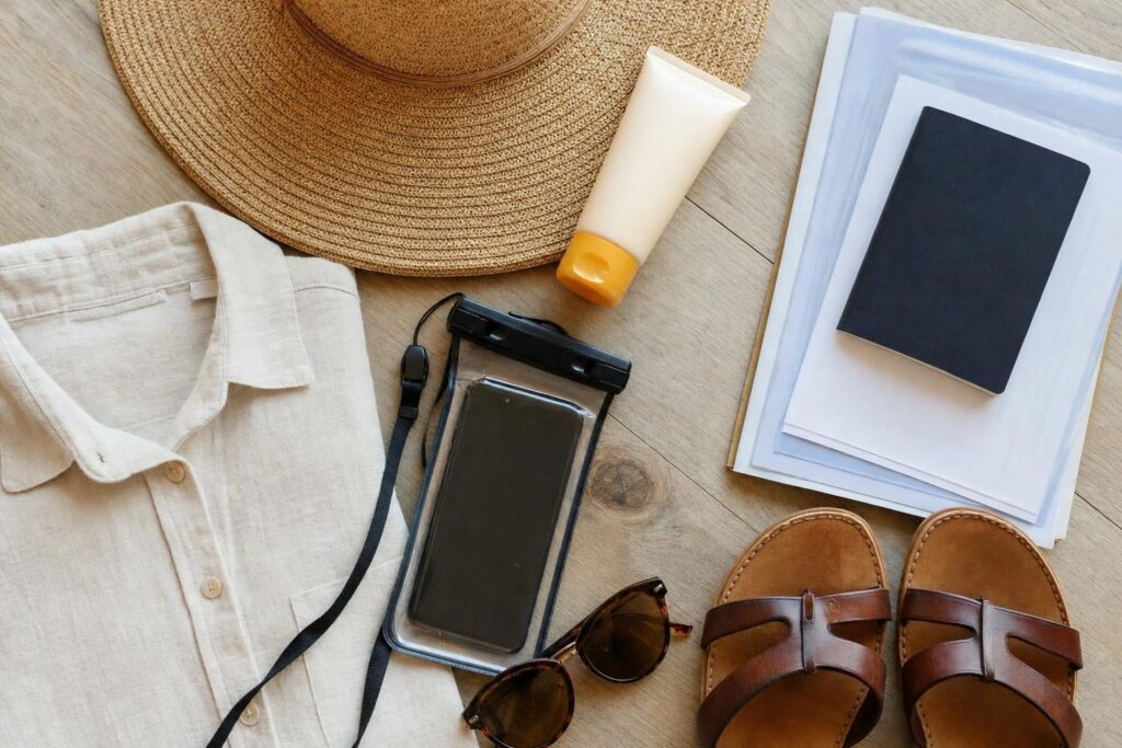 Flat-lay of sun hat, sunscreen, passport and sandals packed for a 7-night Mexican Riviera cruise