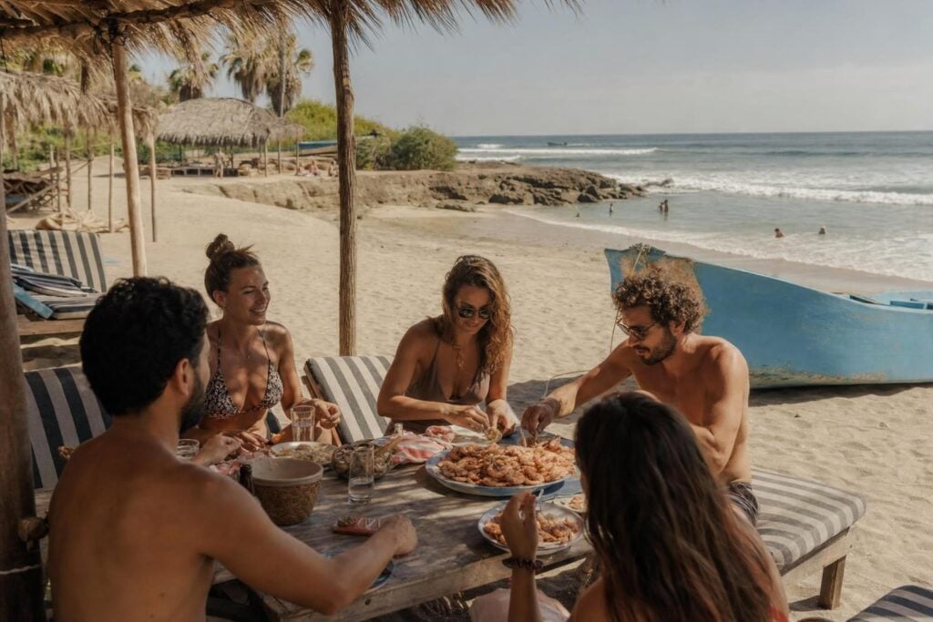 Palapa beach restaurant with shrimp lunch on a Mexican Pacific beach, a typical cruise port day lunch stop